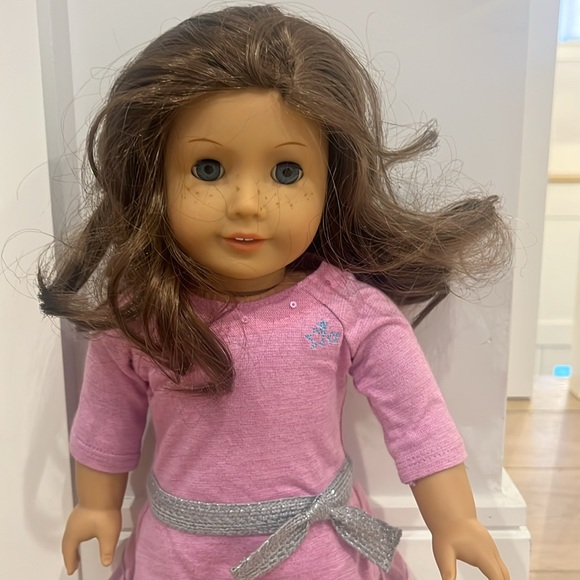 American Girl doll Just Like You in a pink dress.